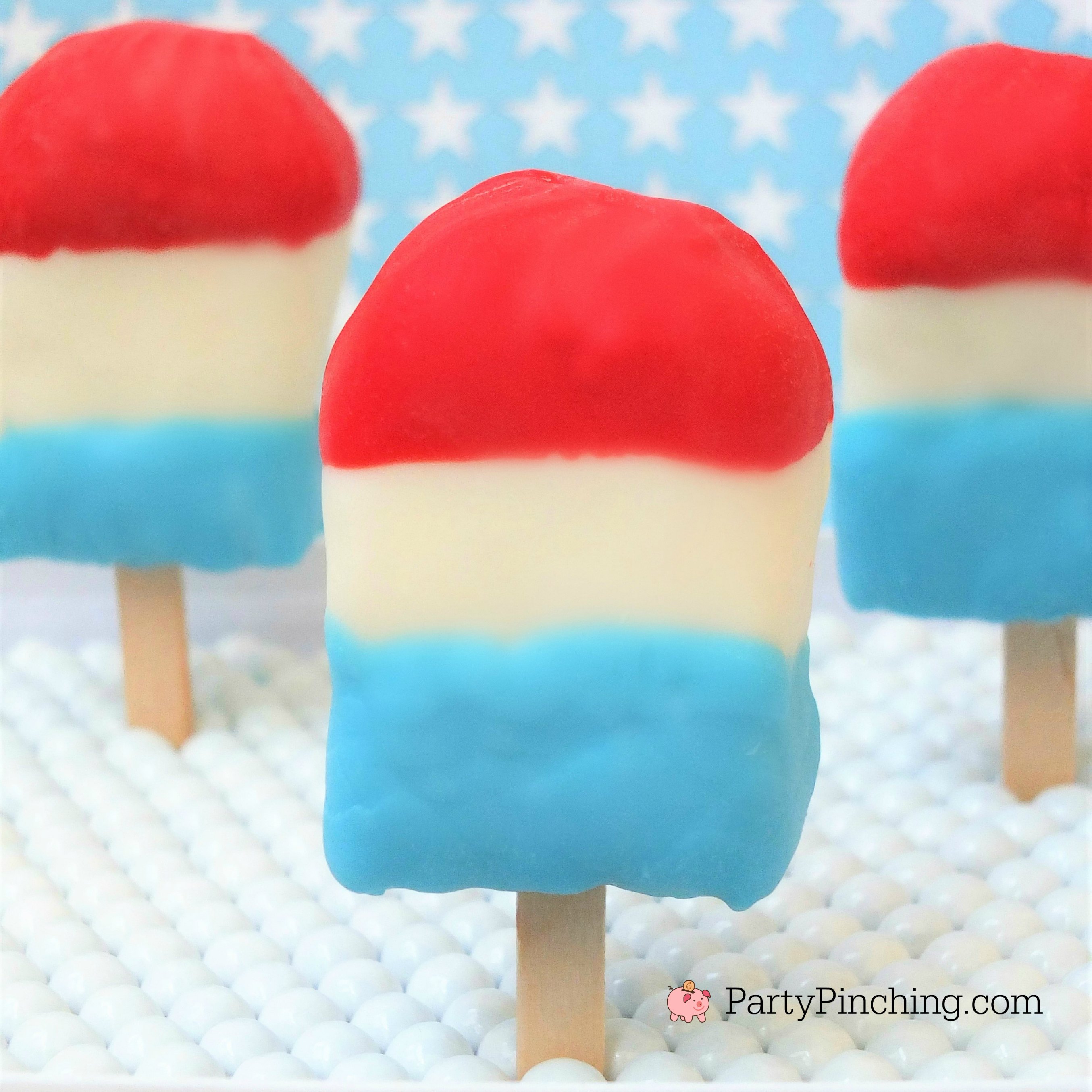 Patriotic rice krispie treat pops, red white and blue treat popsicles, rice treat 4th of July pops, cute 4th of july patriotic dessert for kids, fun food for patriotic picnic, 4th of July party ideas